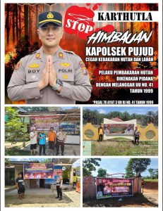 Personel Polsek Pujud Gencarkan Pemasangan Spanduk Himbauan Karhutla