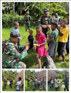 Satgas Yonif 641/Bru Bagikan Baju Baru dan Sendal Kepada Anak-Anak Di Distrik Kurima