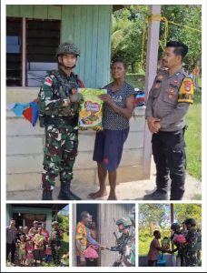 BERSAMA POS POL AROBA MELAKSANAKAN KEGIATAN BERBAGI SEMBAKO DI SEKITARAN DISTRIK AROBA