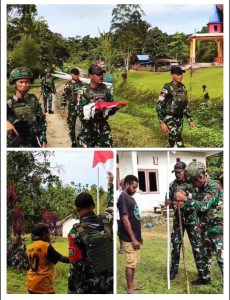 Satgas Yonif 763/SBA Pos Afkrem Bersama Masyarakat Laksanakan Pemasangan Bendera Merah Putih merah di Kampung Afkrem